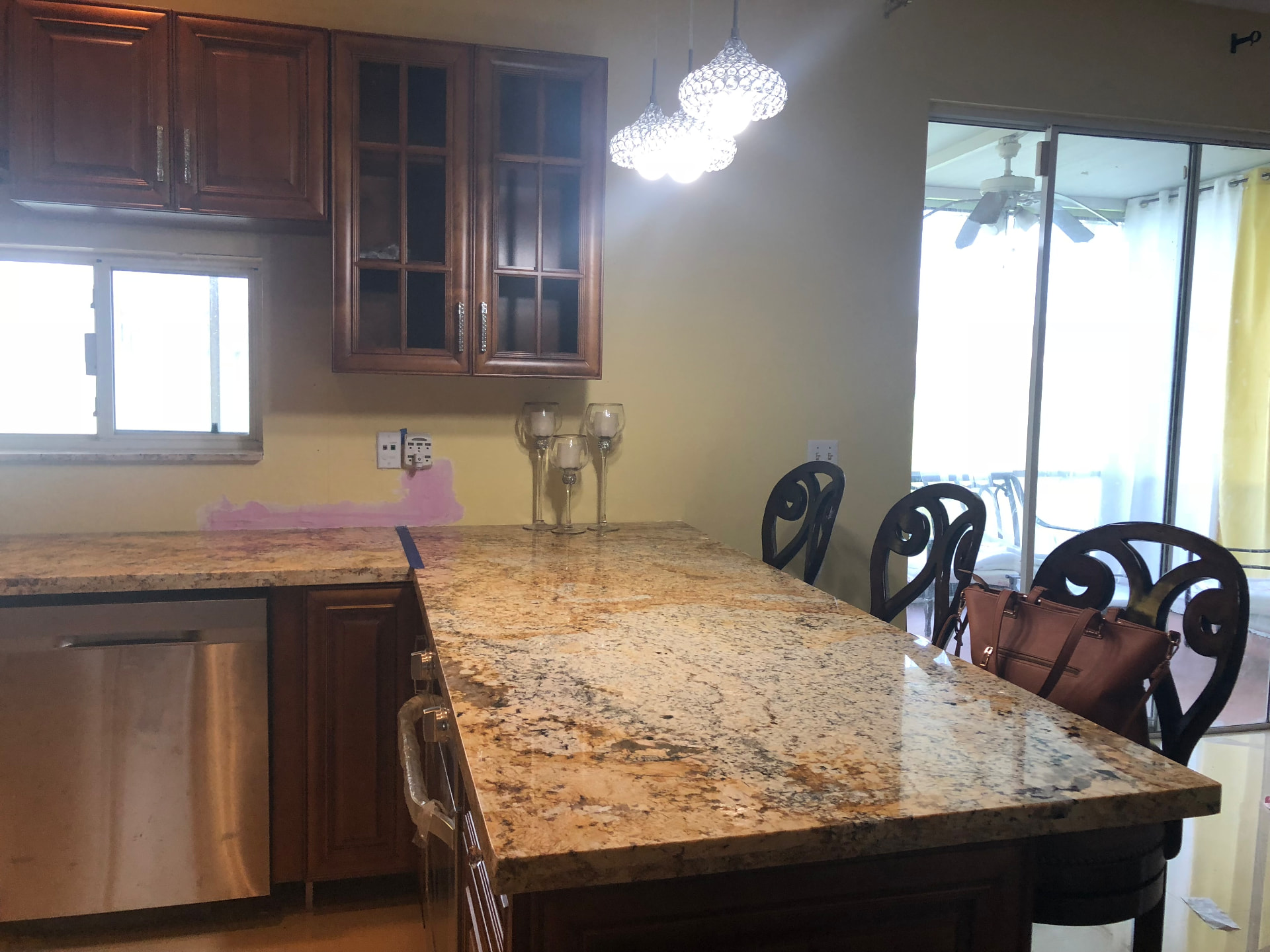 Completed granite bar seating overlooking the patio doors